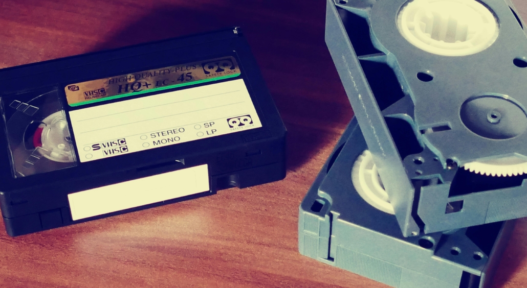 Three VCR tapes on a tabletop.