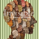 Against a background of bars, a human head made up of many other heads in various soothing colours sports the words: Invisible: A Society of Prisons.