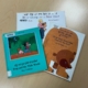 three Punjabi-English picture books on a wooden table