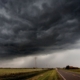 over a flat road, a thundercloud forms.